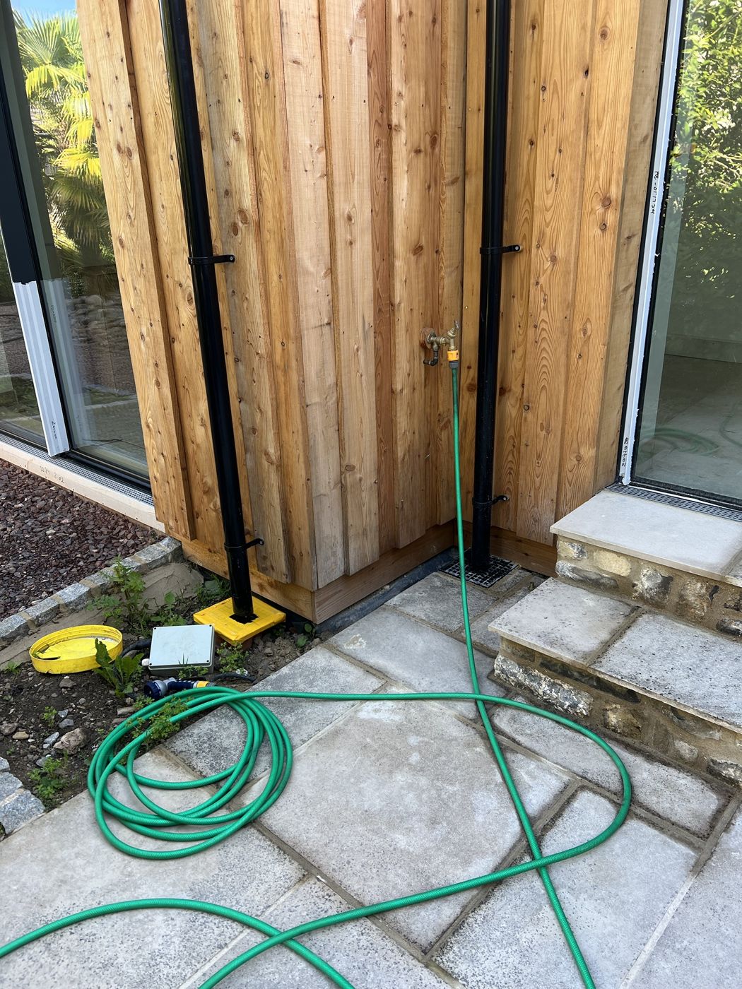 Outside tap on a timber clad wall