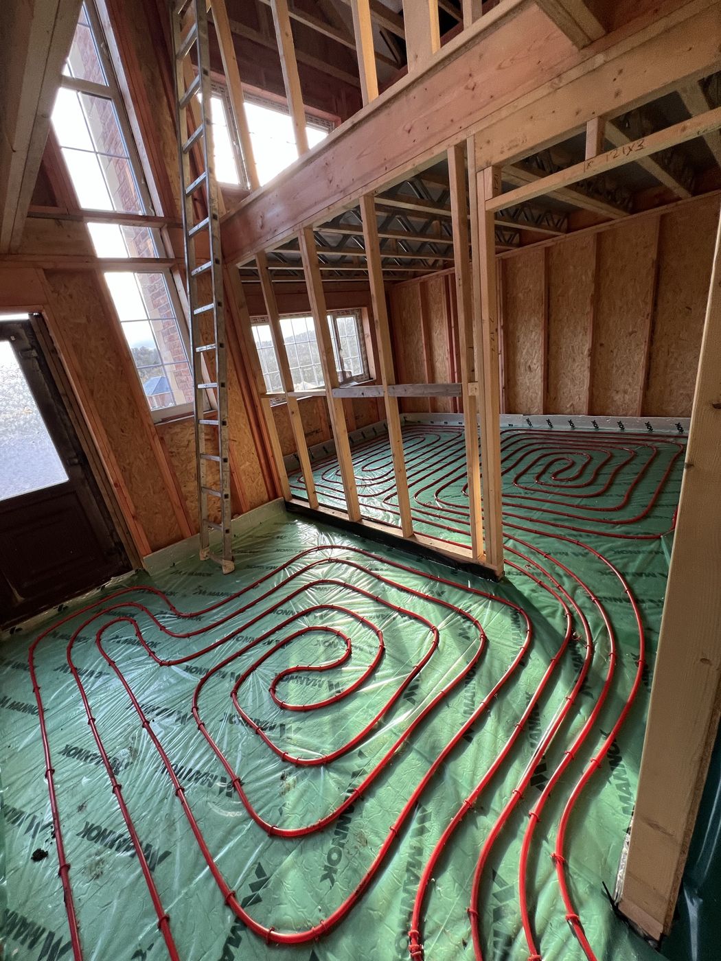 Underfloor heating pipe laid across a whole floor